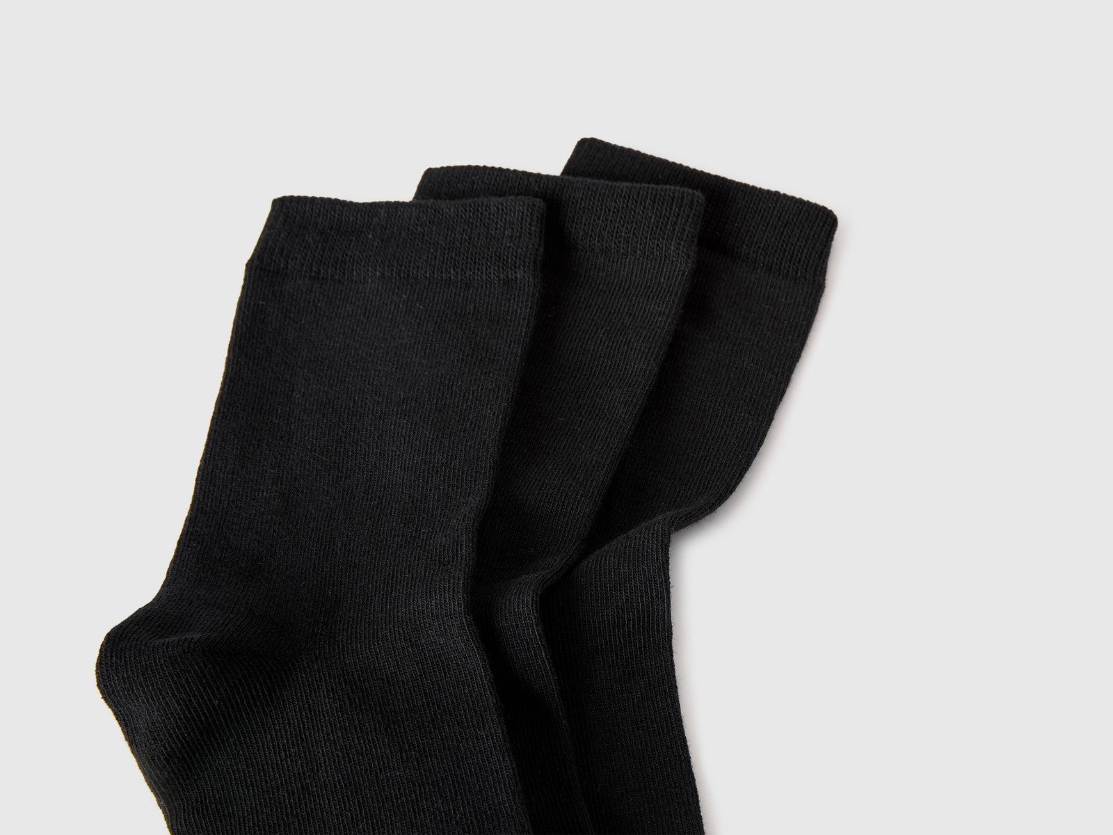 Three pairs of solid-colored medium socks - ucb_image_DS1